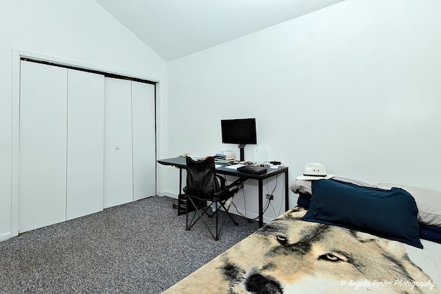 carpeted home office with lofted ceiling