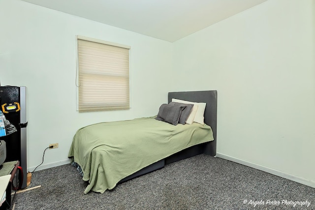 bedroom featuring dark colored carpet