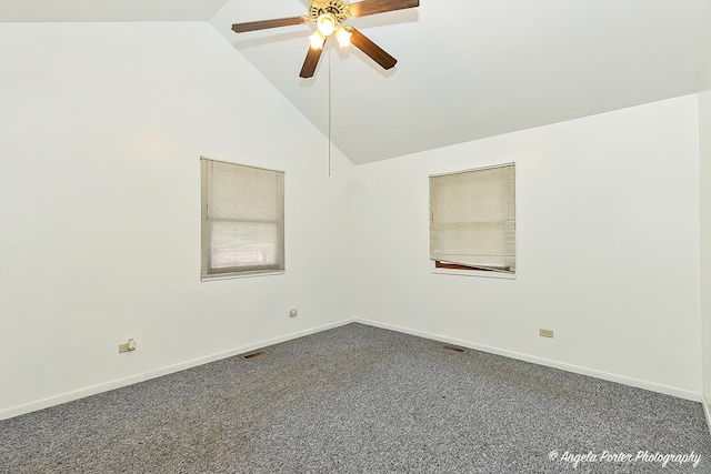 carpeted empty room featuring ceiling fan and high vaulted ceiling