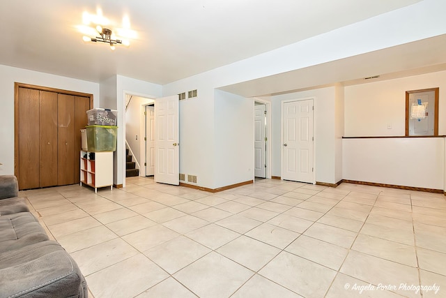 unfurnished living room featuring light tile patterned floors