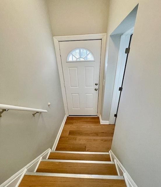 doorway with hardwood / wood-style flooring