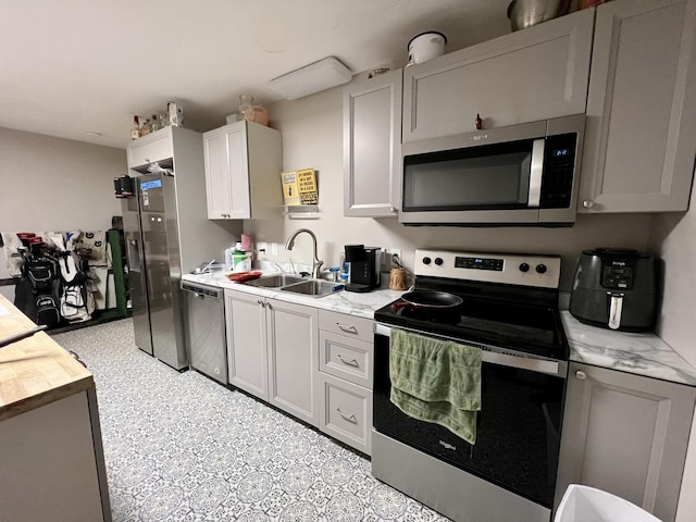 kitchen featuring appliances with stainless steel finishes and sink
