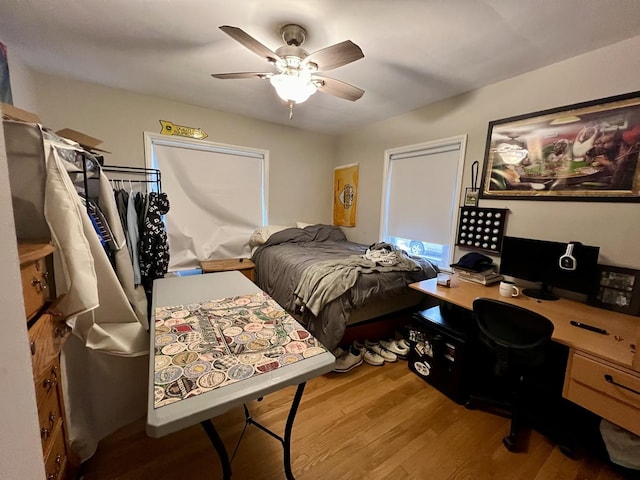 bedroom featuring ceiling fan and wood-type flooring