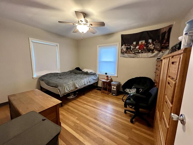 bedroom featuring ceiling fan and hardwood / wood-style floors
