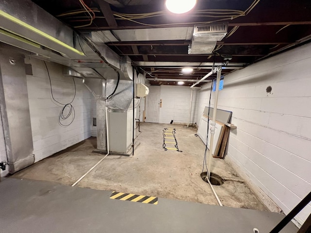 basement featuring heating unit