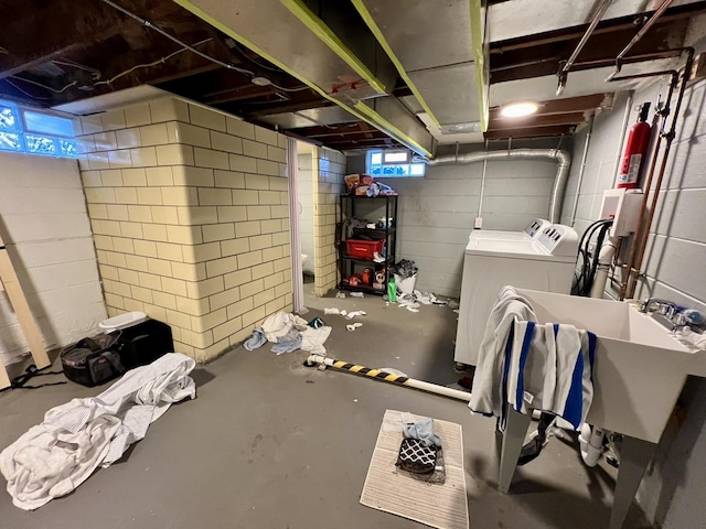 basement featuring washing machine and clothes dryer