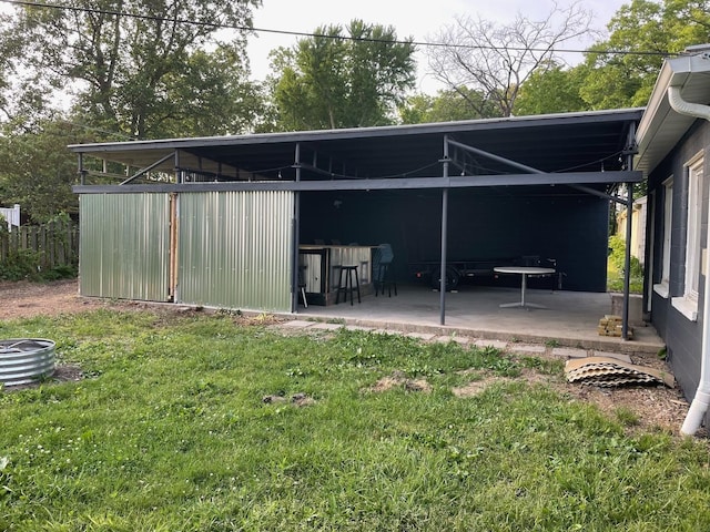 exterior space with a lawn and a bar