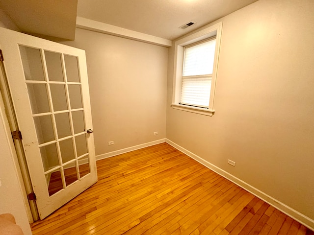 unfurnished room with light hardwood / wood-style floors