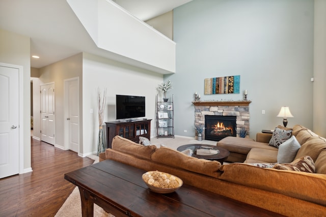 living room featuring dark hardwood / wood-style floors and a fireplace