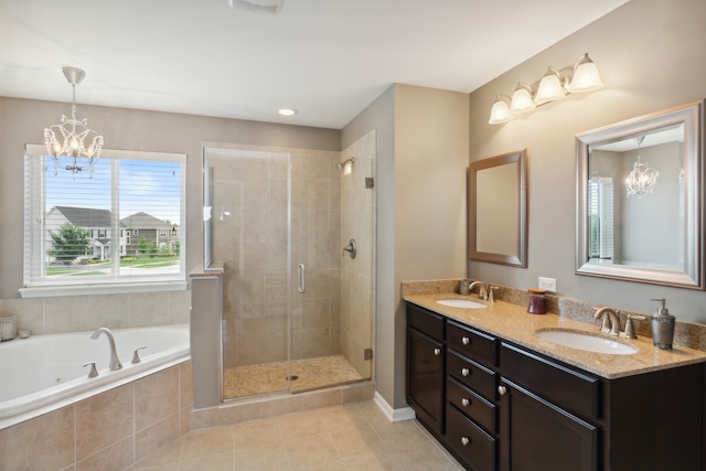 bathroom featuring tile patterned flooring, a notable chandelier, separate shower and tub, and vanity