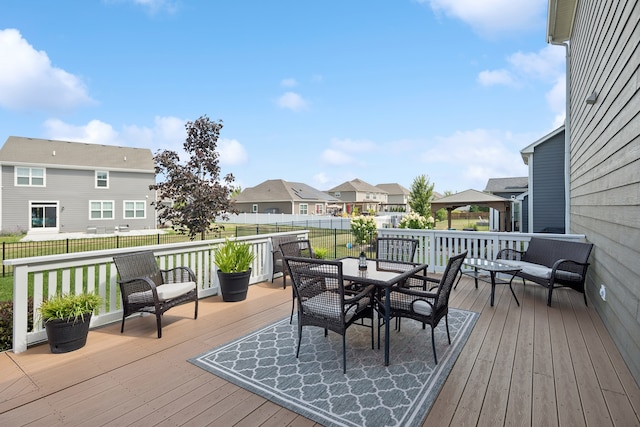 wooden terrace featuring a yard