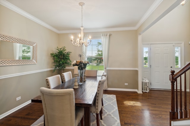 dining room with a chandelier, dark hardwood / wood-style flooring, and ornamental molding