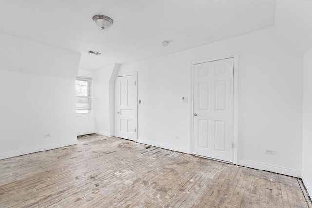 spare room with light hardwood / wood-style floors