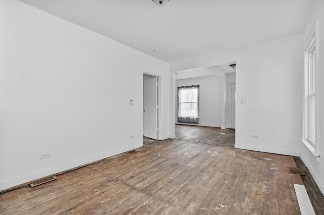 spare room with hardwood / wood-style floors