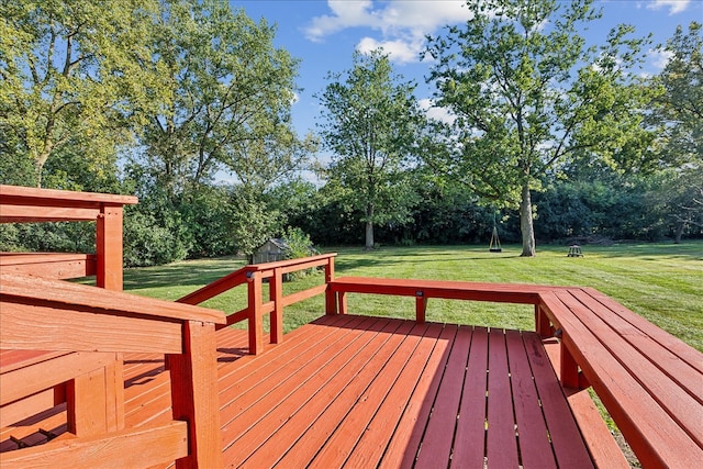 wooden terrace with a lawn