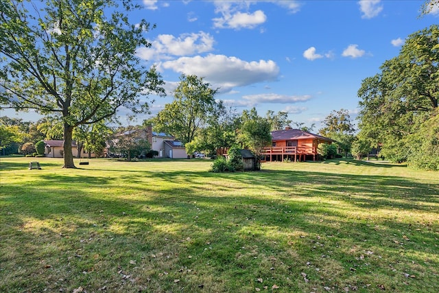 view of yard with a wooden deck