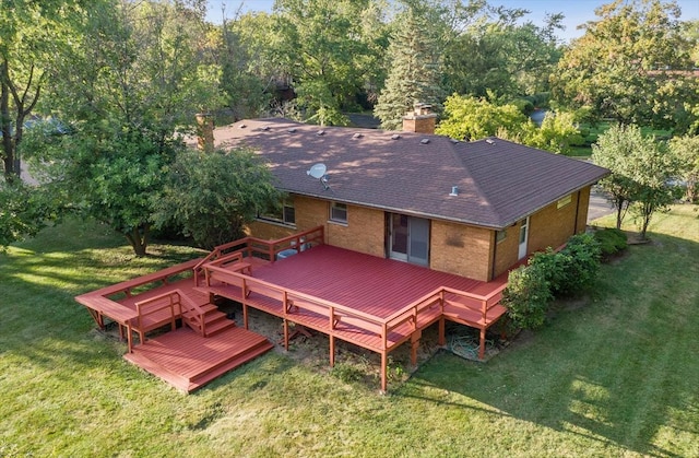 exterior space featuring a lawn and a wooden deck