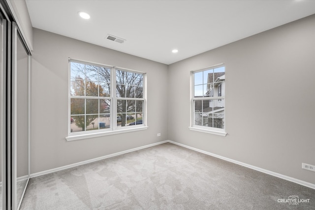 empty room with carpet and plenty of natural light