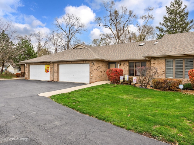 single story home featuring a front yard and a garage