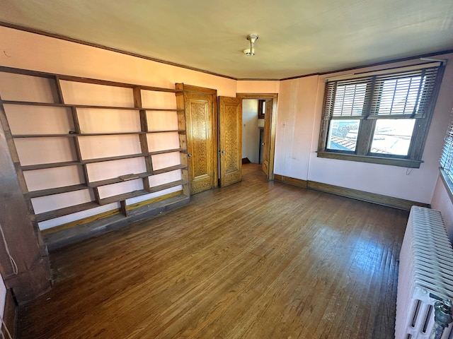 interior space featuring dark hardwood / wood-style floors and radiator