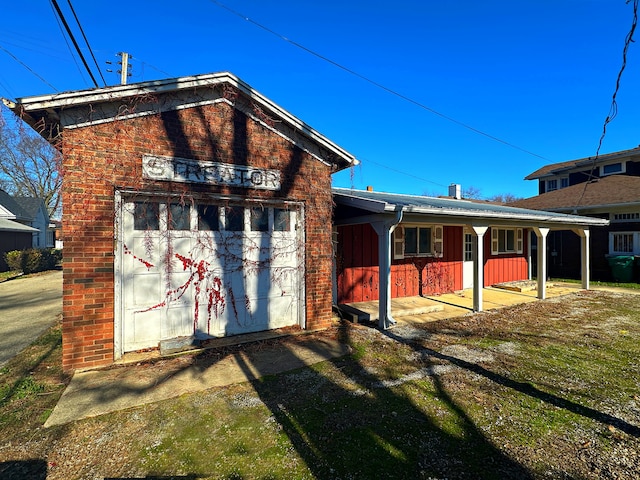 view of outbuilding featuring covered porch