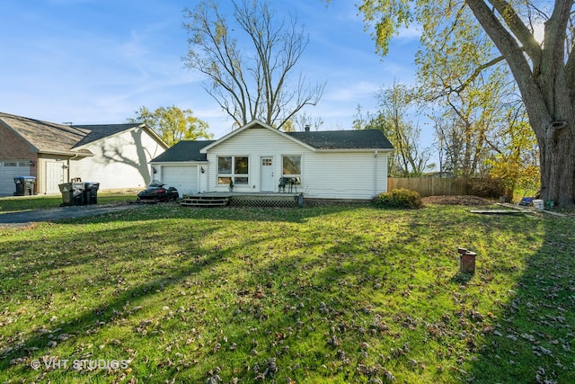 view of front facade featuring a front lawn and a wooden deck