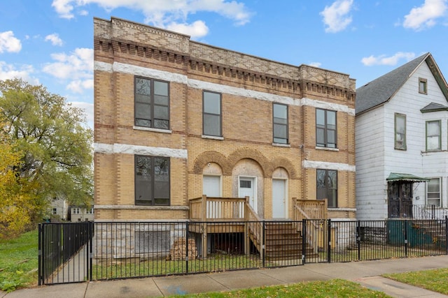 6427 S Aberdeen St, Chicago, IL 60621 - townhome / multi-family property featuring brick siding, a fenced front yard, and a gate
