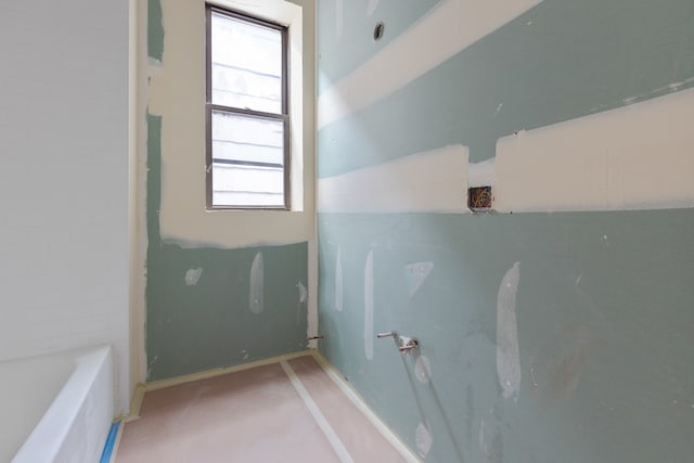 bathroom with a washtub and a wealth of natural light