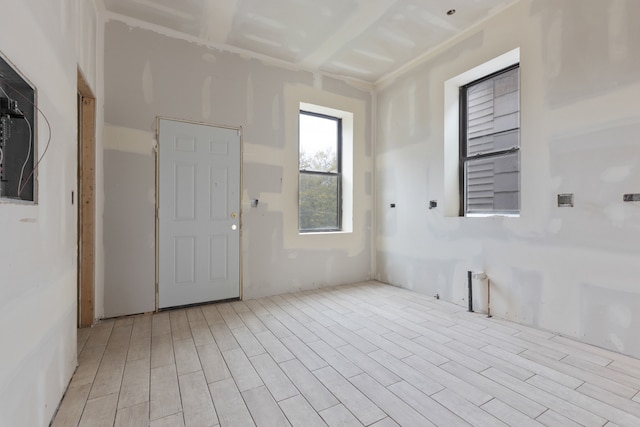 spare room with light wood-type flooring