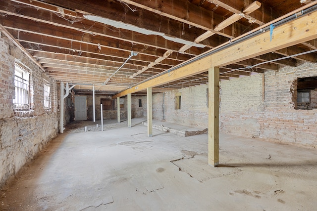 basement with brick wall