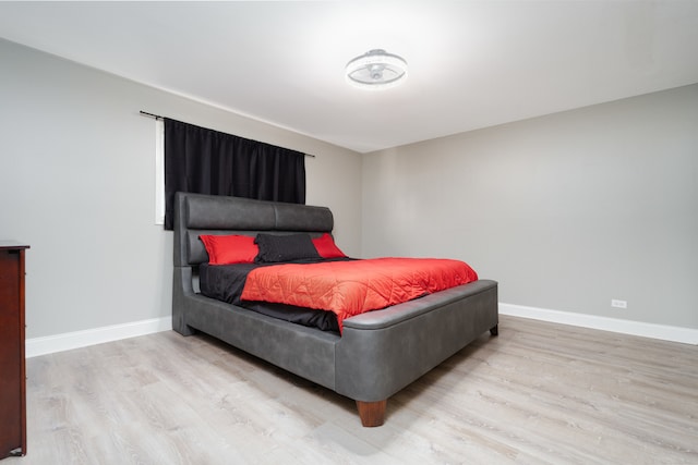 bedroom with light hardwood / wood-style floors