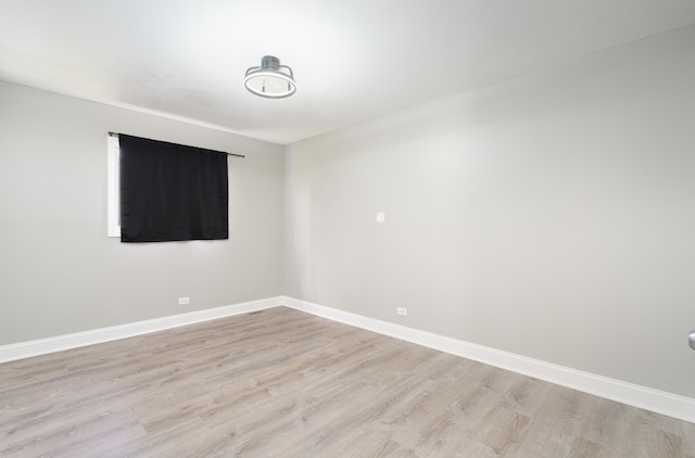 unfurnished room with light hardwood / wood-style flooring