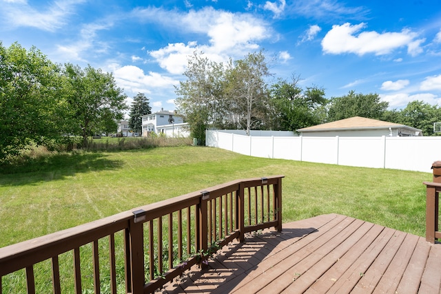 wooden terrace with a lawn