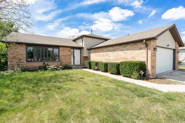 tri-level home with a front lawn and a garage