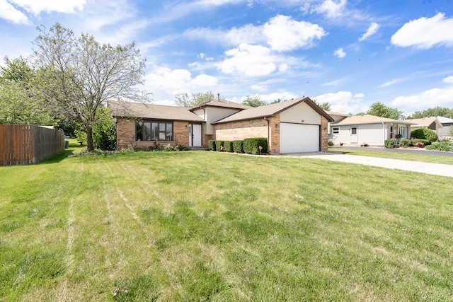 view of front of property with a garage and a front lawn