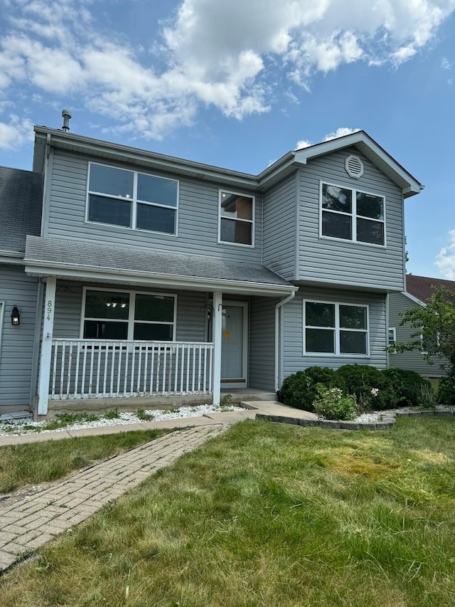 view of front property with a porch and a front lawn