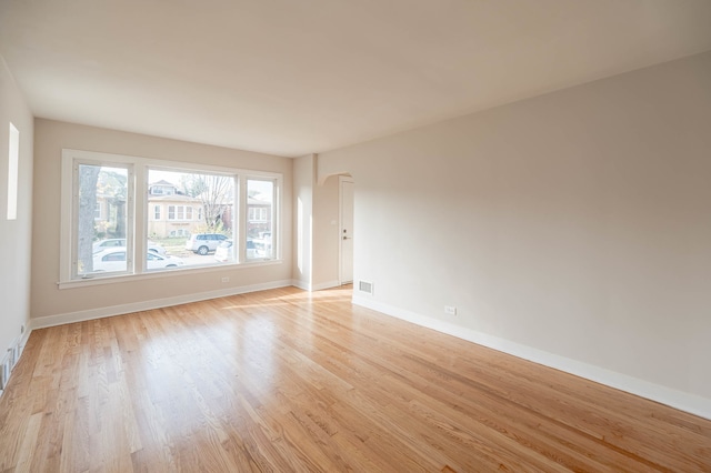 spare room featuring light hardwood / wood-style floors