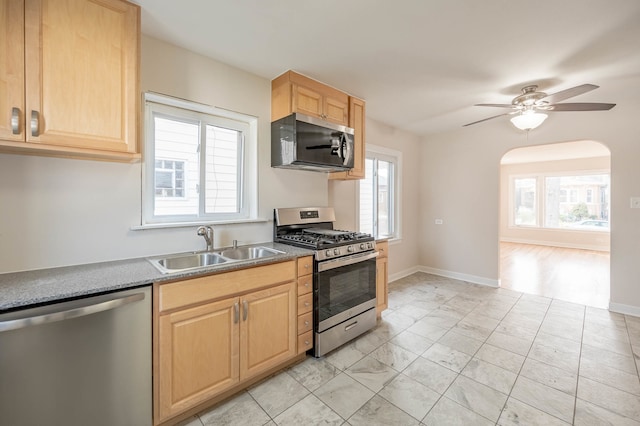 kitchen featuring ceiling fan, light brown cabinets, sink, and appliances with stainless steel finishes