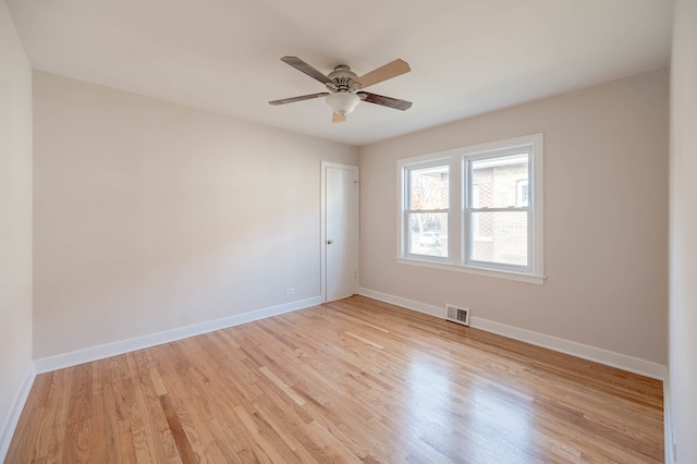 spare room with ceiling fan and light hardwood / wood-style flooring