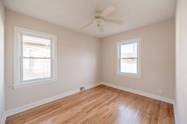 unfurnished room featuring ceiling fan and light hardwood / wood-style flooring