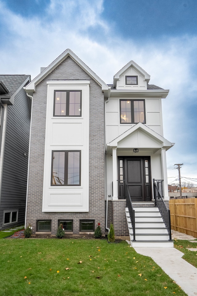 view of front of house with a front lawn