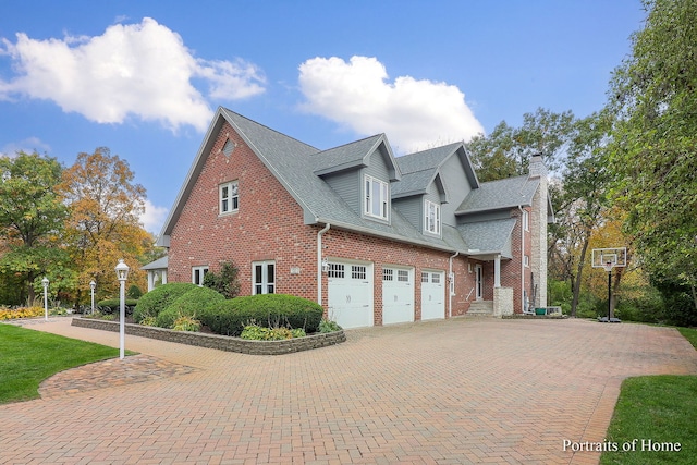 view of side of property with a garage