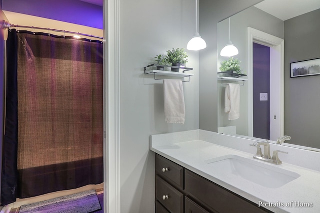 bathroom with vanity and walk in shower