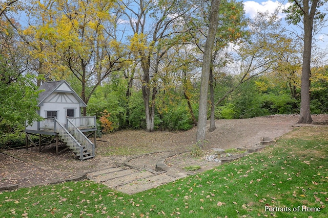 view of yard featuring a wooden deck