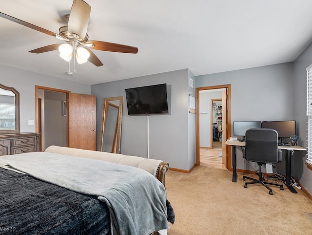 carpeted bedroom with a closet and ceiling fan