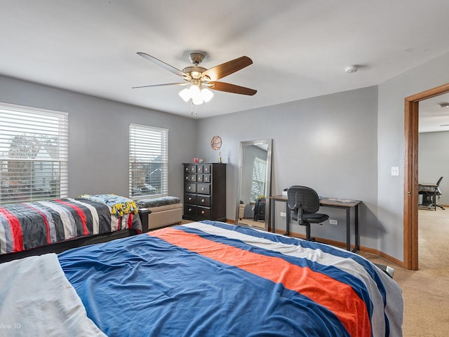 carpeted bedroom with ceiling fan