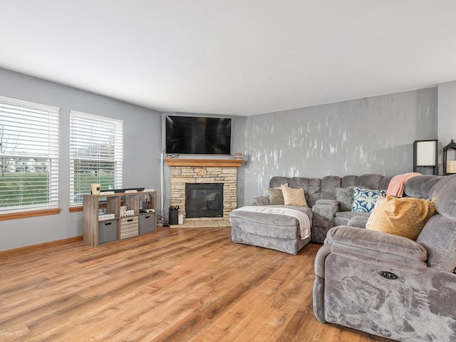 living room with a fireplace and light hardwood / wood-style floors