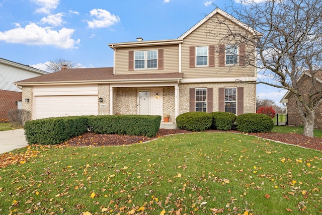 view of front property with a garage and a front lawn