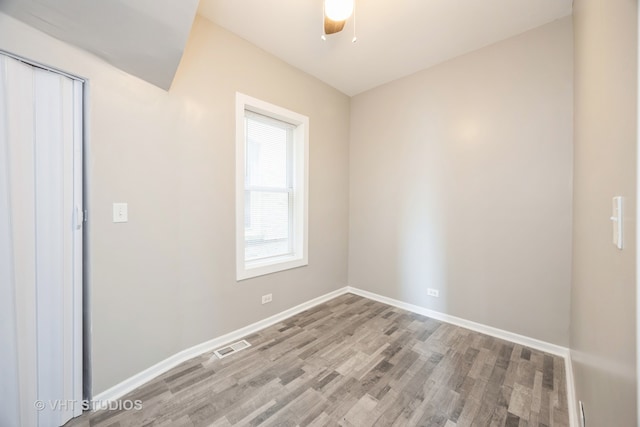 spare room featuring ceiling fan and hardwood / wood-style floors