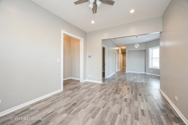 empty room featuring light hardwood / wood-style floors and ceiling fan